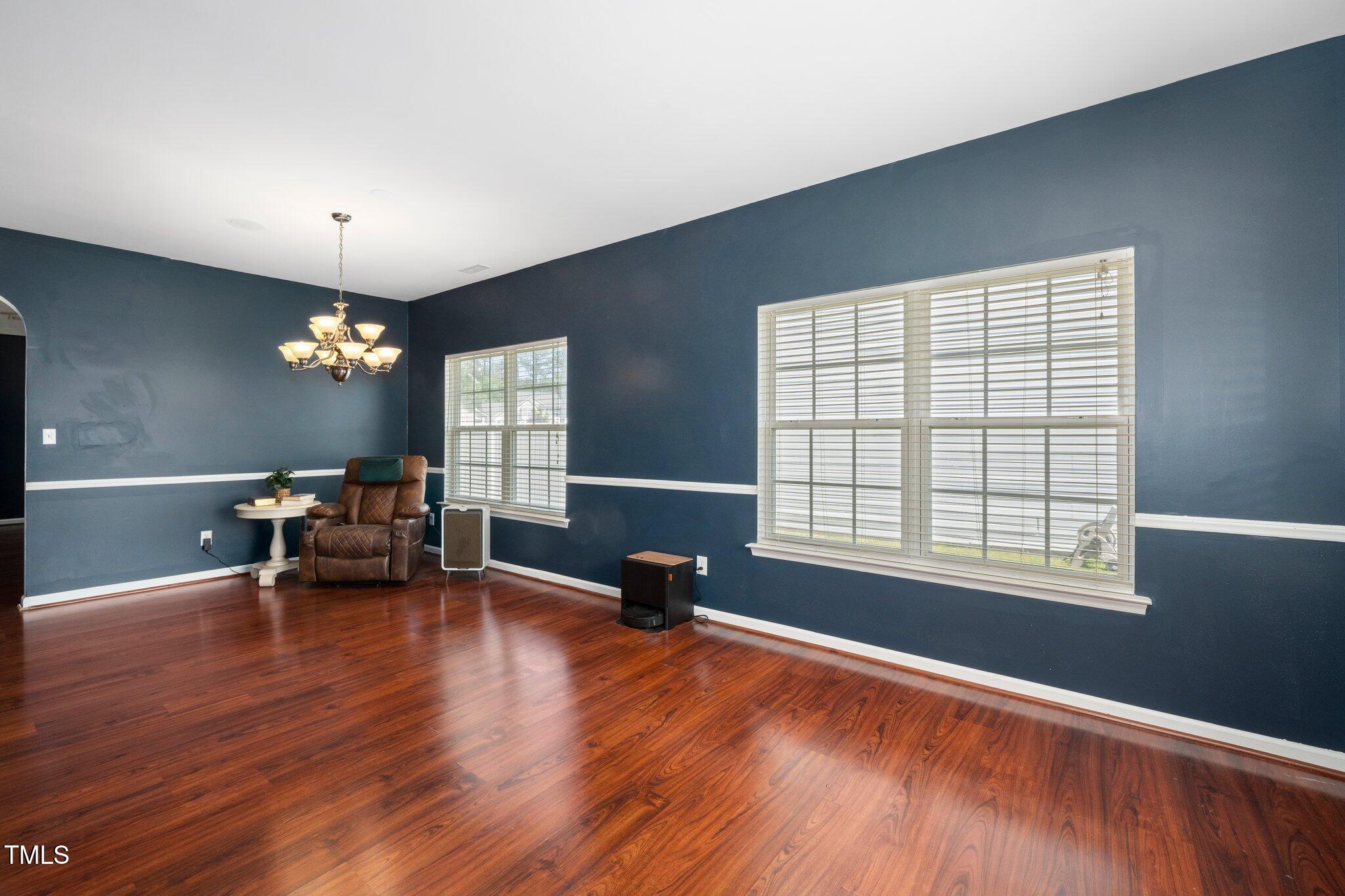 8300 Neuse Hunter Drive Raleigh, NC 27616 - Photo 4 of 32 a living room with furniture and a wooden floor