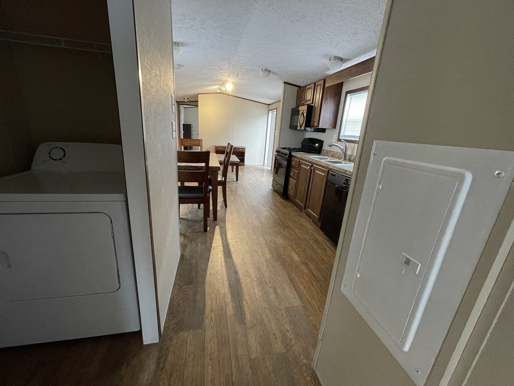 268 Palmer Road, Unit 23 Monson, MA 01057 - Photo 11 of 18 a view of a kitchen from the hallway