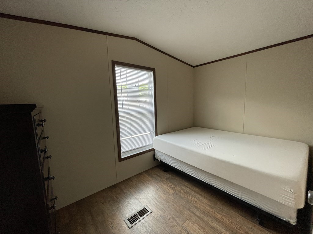 268 Palmer Road, Unit 23 Monson, MA 01057 - Photo 14 of 18 a bed room with a bed and a window
