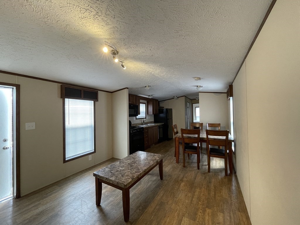 268 Palmer Road, Unit 23 Monson, MA 01057 - Photo 4 of 18 a dining room with furniture and wooden floor