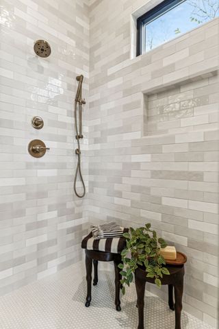a bathroom with a shower sink and mirror