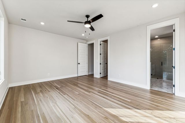 a kitchen with stainless steel appliances granite countertop a refrigerator a sink and a stove