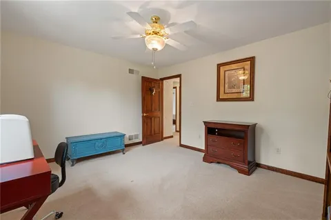 a bed room with a bed and a chandelier