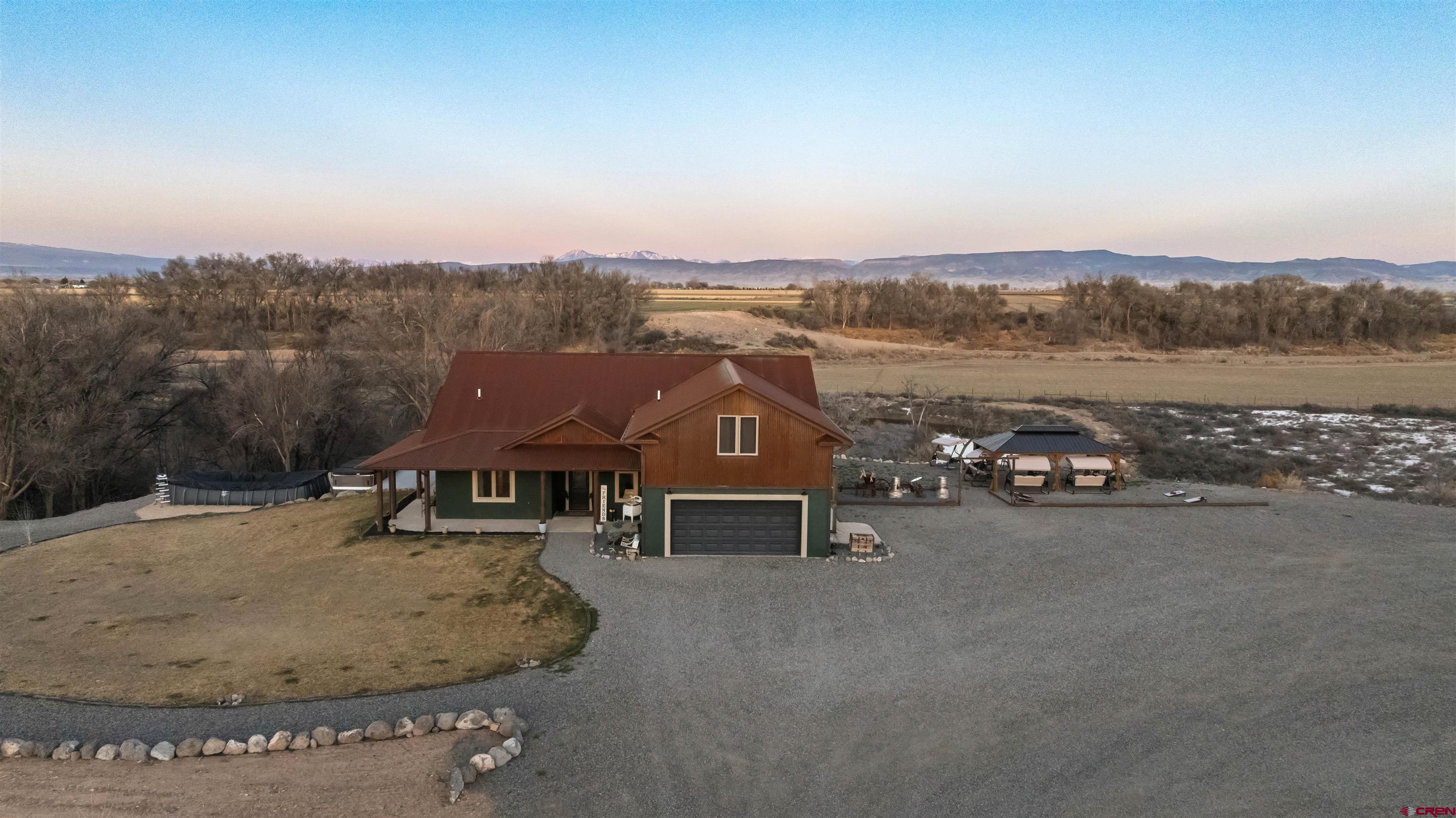 55347 Begonia Road Delta, CO 81416 - Photo 1 of 44 a view of a house with a yard