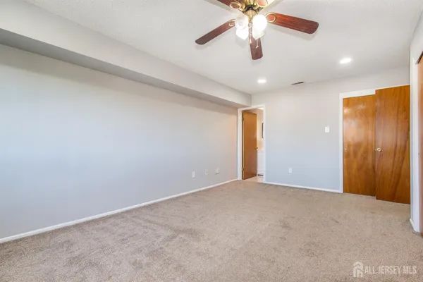 a bathroom with a toilet sink and a mirror