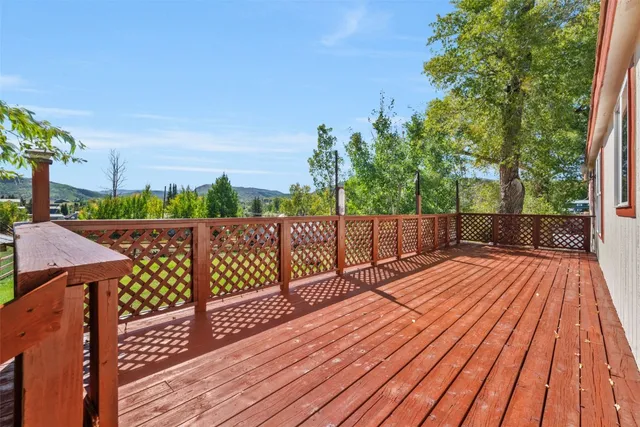 a view of deck with wooden floor and outdoor seating
