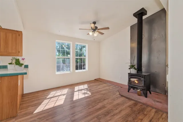 a view of a workspace with wooden floor
