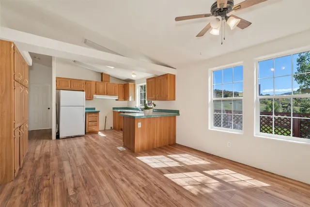 a view of kitchen with wooden floor and window