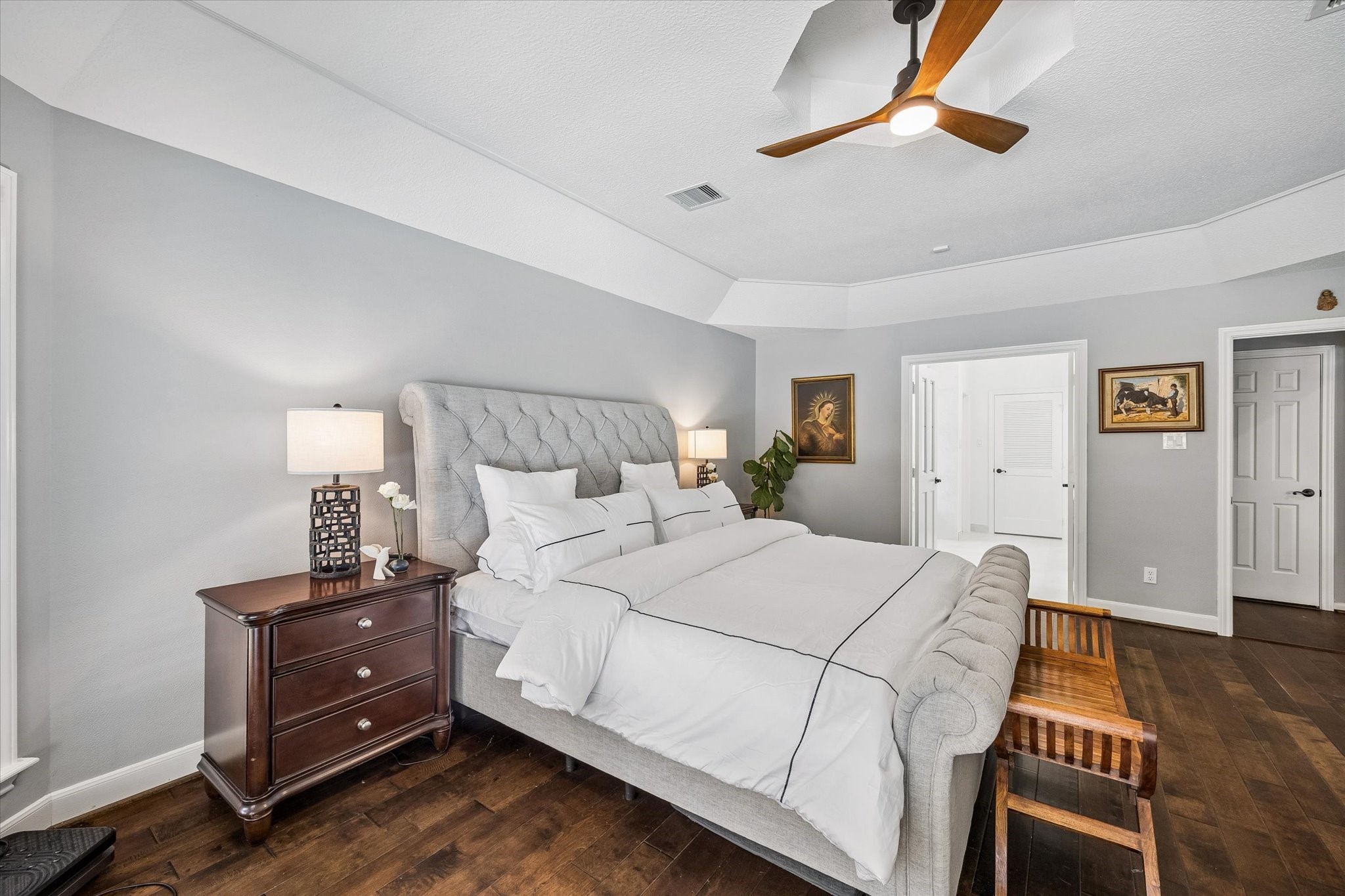 146 Golden Shadow Circle Spring, TX 77381 - Photo 20 of 41 The expansive primary bedroom reveals, through double doors, a luxurious en-suite bathroom, creating a private retreat designed for rest and relaxation.