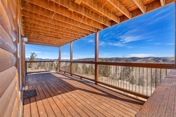 a view of balcony with wooden floor