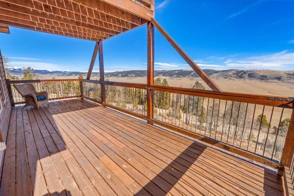 a view of balcony with couch and wooden floor