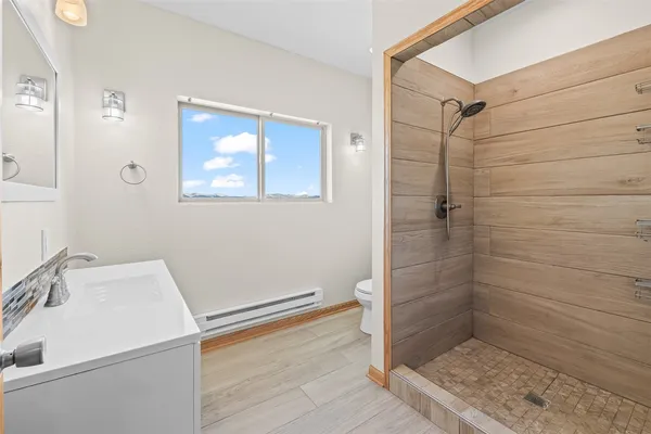 a bathroom with a sink and shower