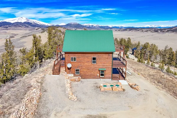 an aerial view of a house with a ocean view