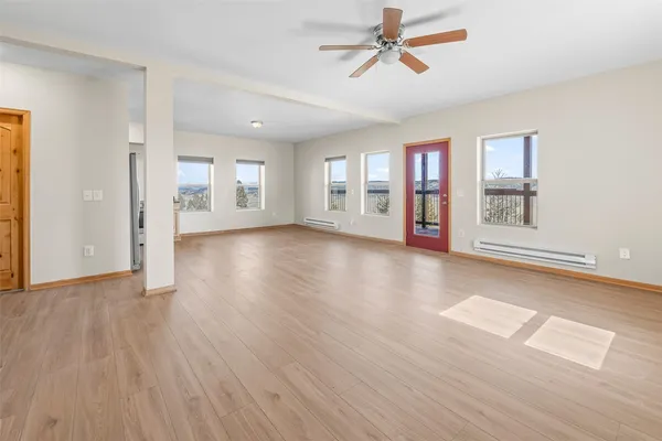 a view of a livingroom with hardwood floor and a window