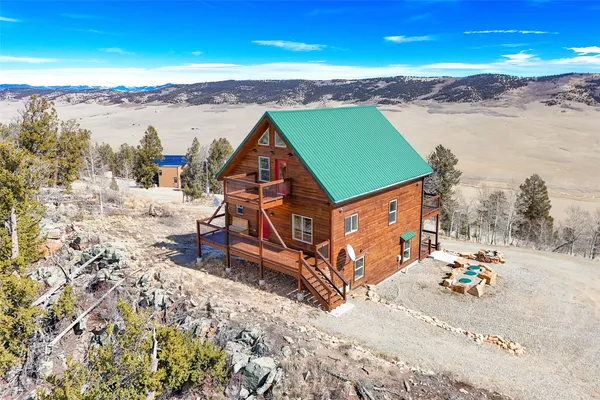an aerial view of a house with a ocean view