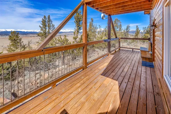 a view of balcony with wooden floor