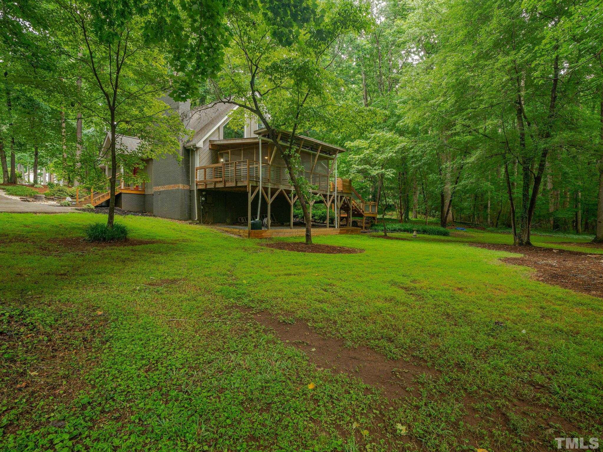 3116 Paxton Place Raleigh, NC 27613 - Photo 3 of 67 a front view of a house with a yard
