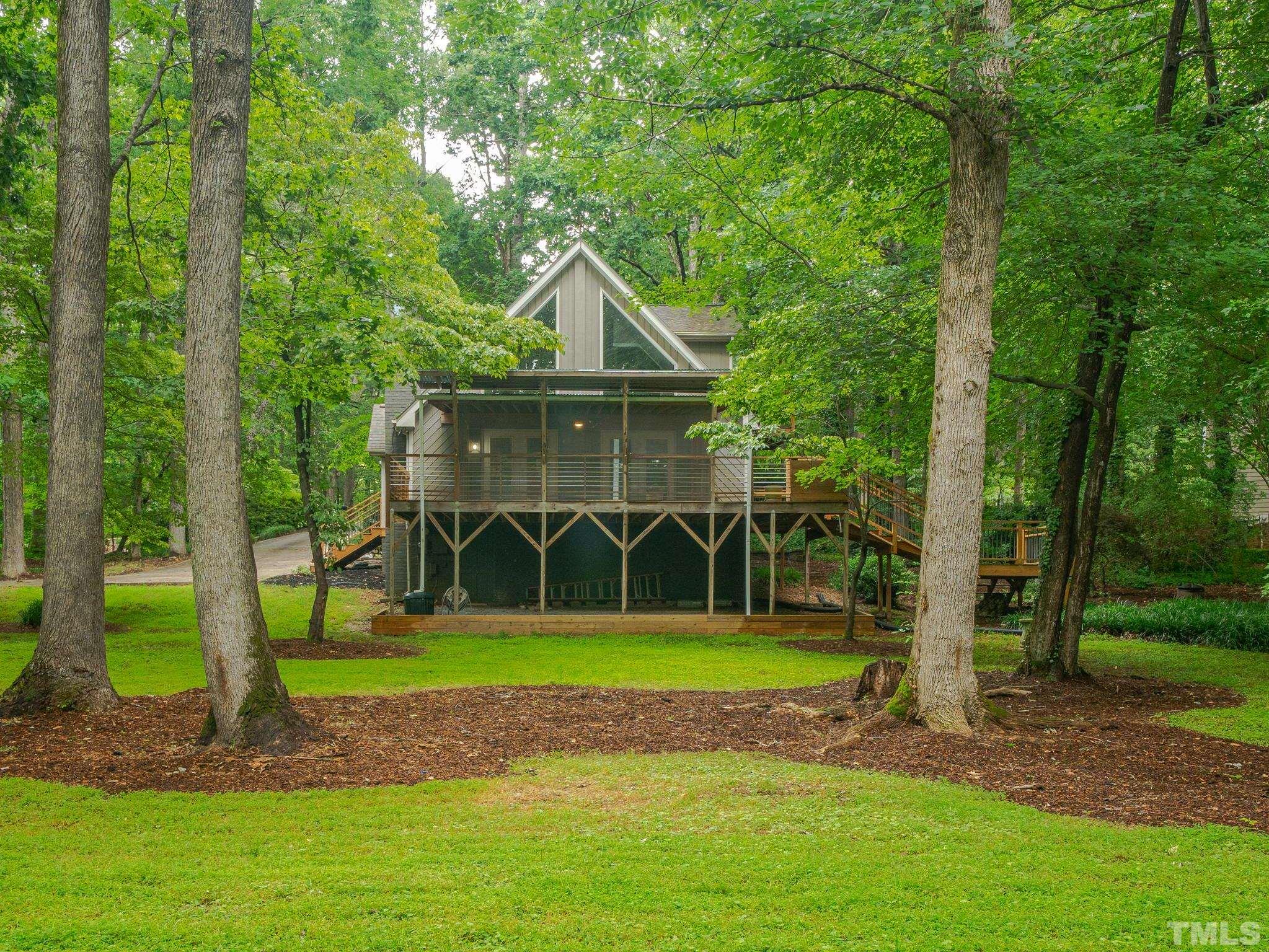 3116 Paxton Place Raleigh, NC 27613 - Photo 8 of 67 a view of a house with a backyard