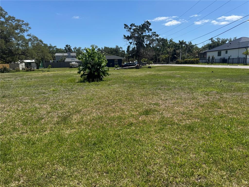 Dona Way Nokomis, FL 34275 - Photo 1 of 5 a view of a field with a tree in the background