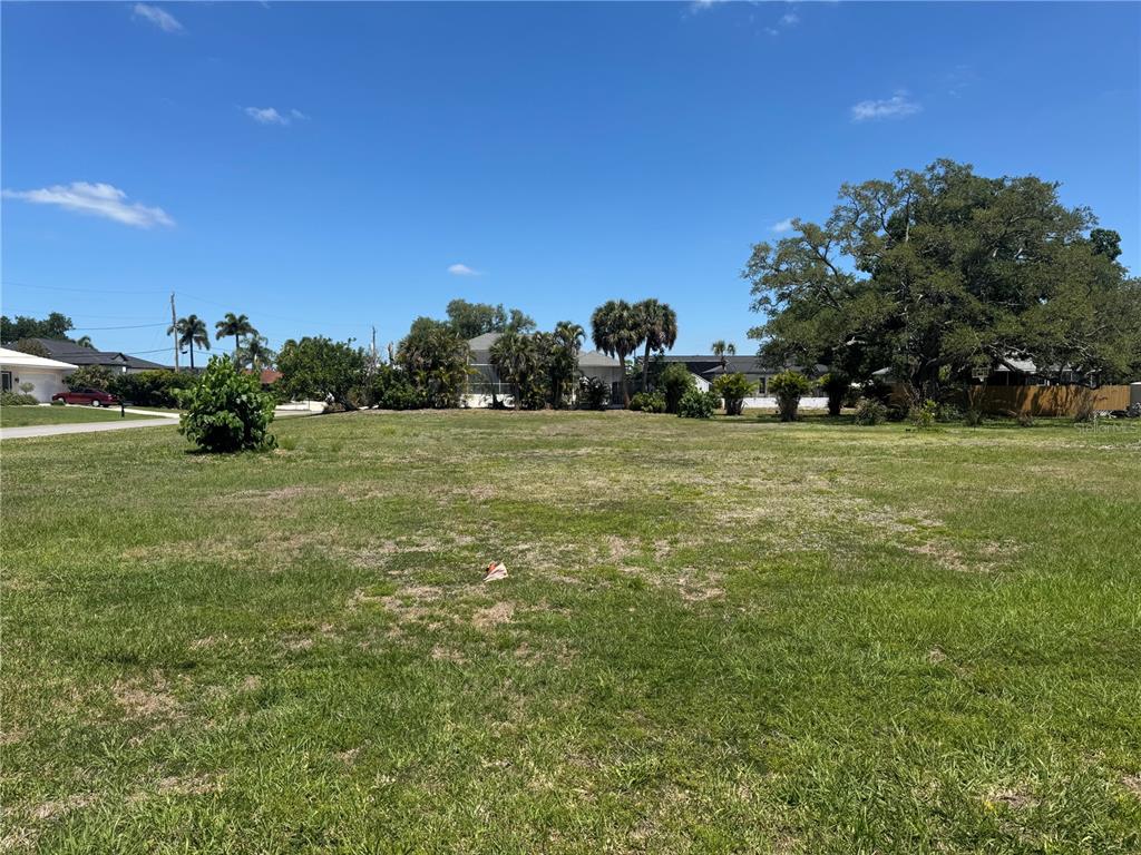 Dona Way Nokomis, FL 34275 - Photo 3 of 5 a view of a field with an trees in the background