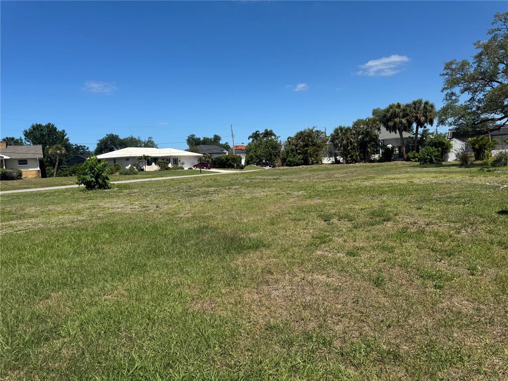 Dona Way Nokomis, FL 34275 - Photo 4 of 5 a car parked in the middle of a field