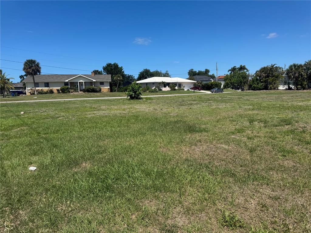 Dona Way Nokomis, FL 34275 - Photo 5 of 5 a car parked in the middle of a field