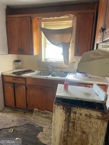 a kitchen with a sink and a window