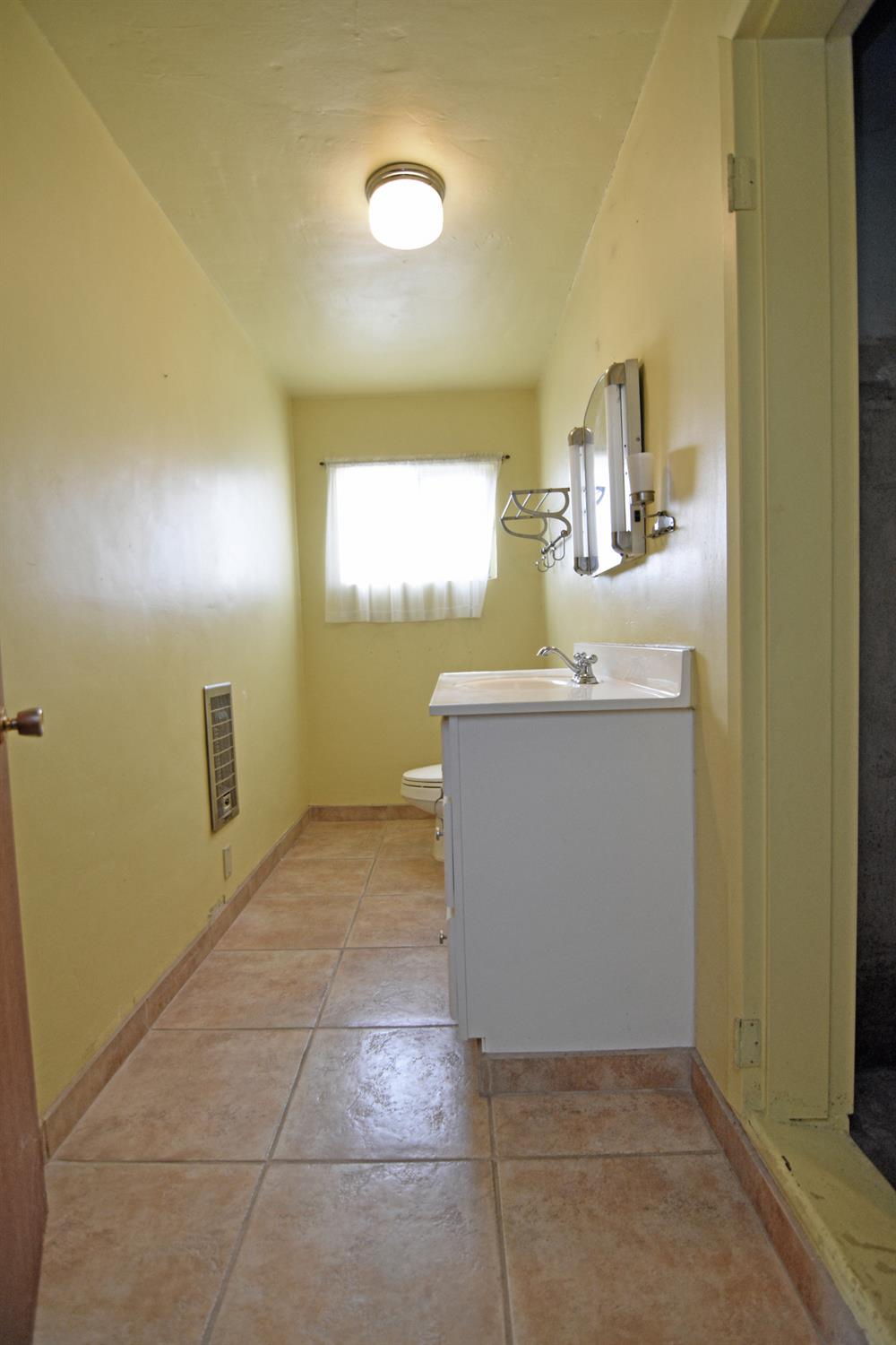 1206 South Verduga Road Turlock, CA 95380 - Photo 21 of 36 a room with a sink
