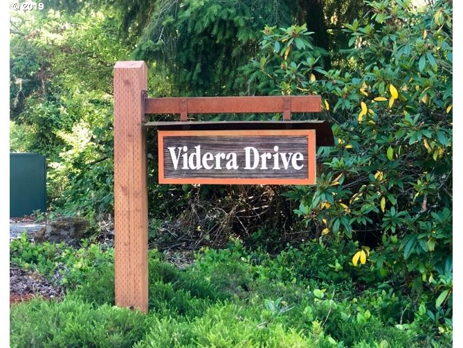 Videra Drive Eugene, OR 97405 - Photo 2 of 2 a view of sign board with tall trees