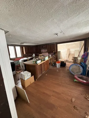 a living room with furniture a flat screen tv and a large window