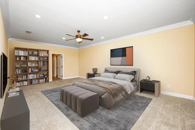 a spacious bedroom with a large bed a chandelier and a book shelf