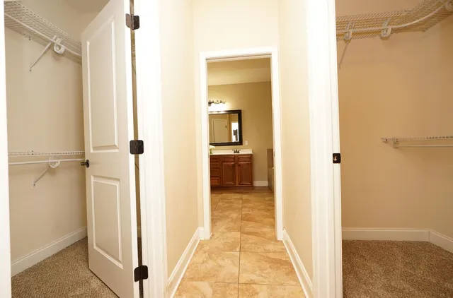 a view of a bathroom from a hallway