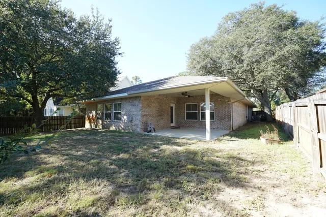 a house that has tree in front of it