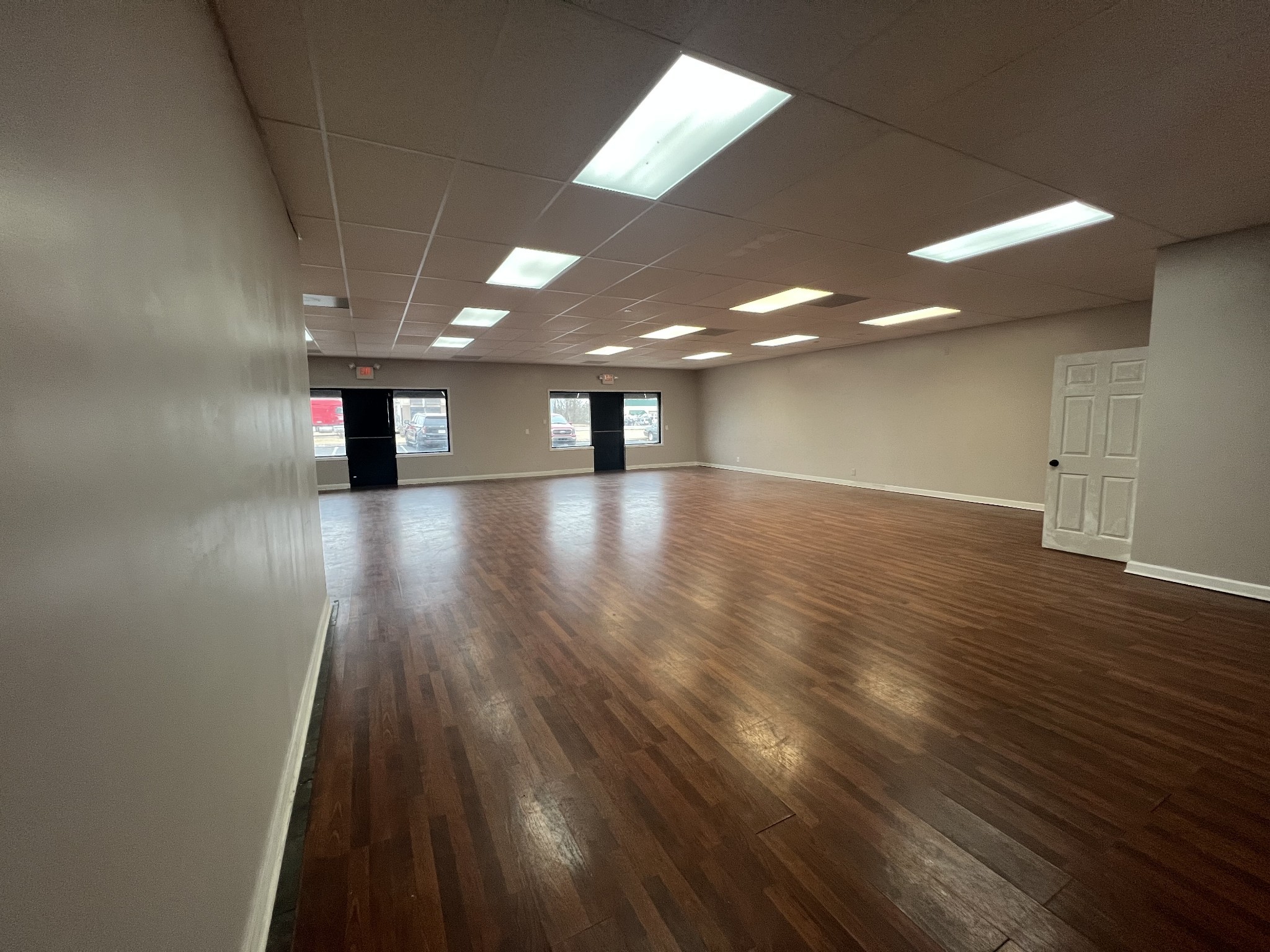 149 Kender Rhea Court Clarksville, TN 37043 - Photo 12 of 26 an empty room with wooden floor and windows