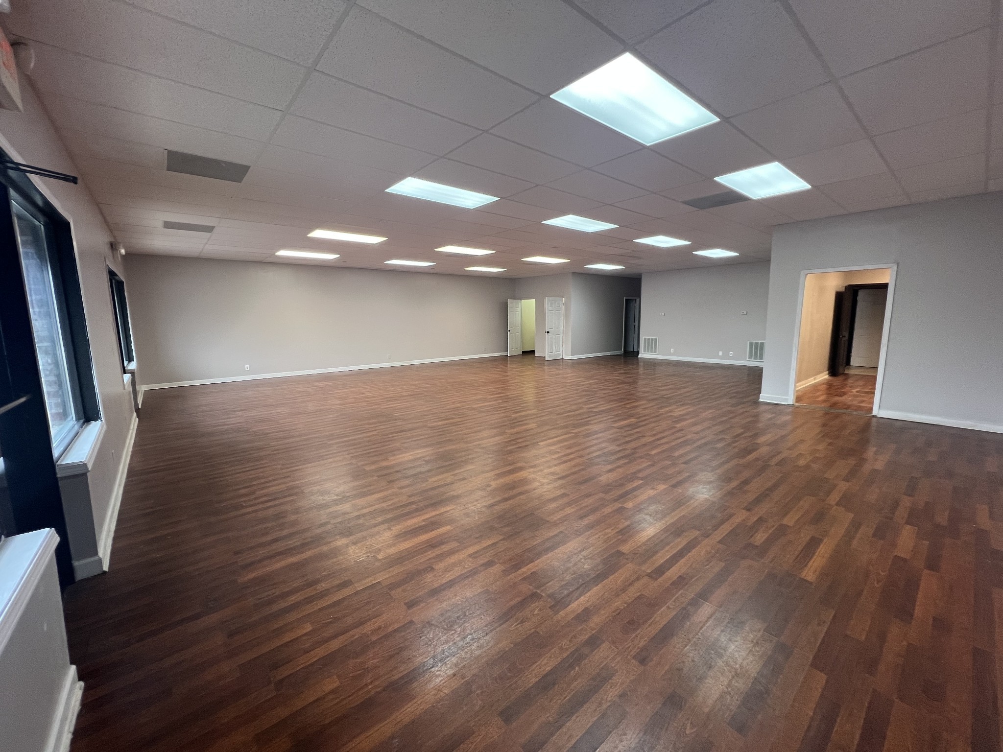 149 Kender Rhea Court Clarksville, TN 37043 - Photo 6 of 26 an empty room with wooden floor and windows