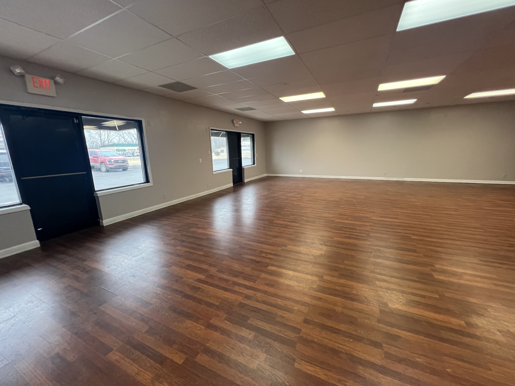 149 Kender Rhea Court Clarksville, TN 37043 - Photo 7 of 26 an empty room with wooden floor and windows