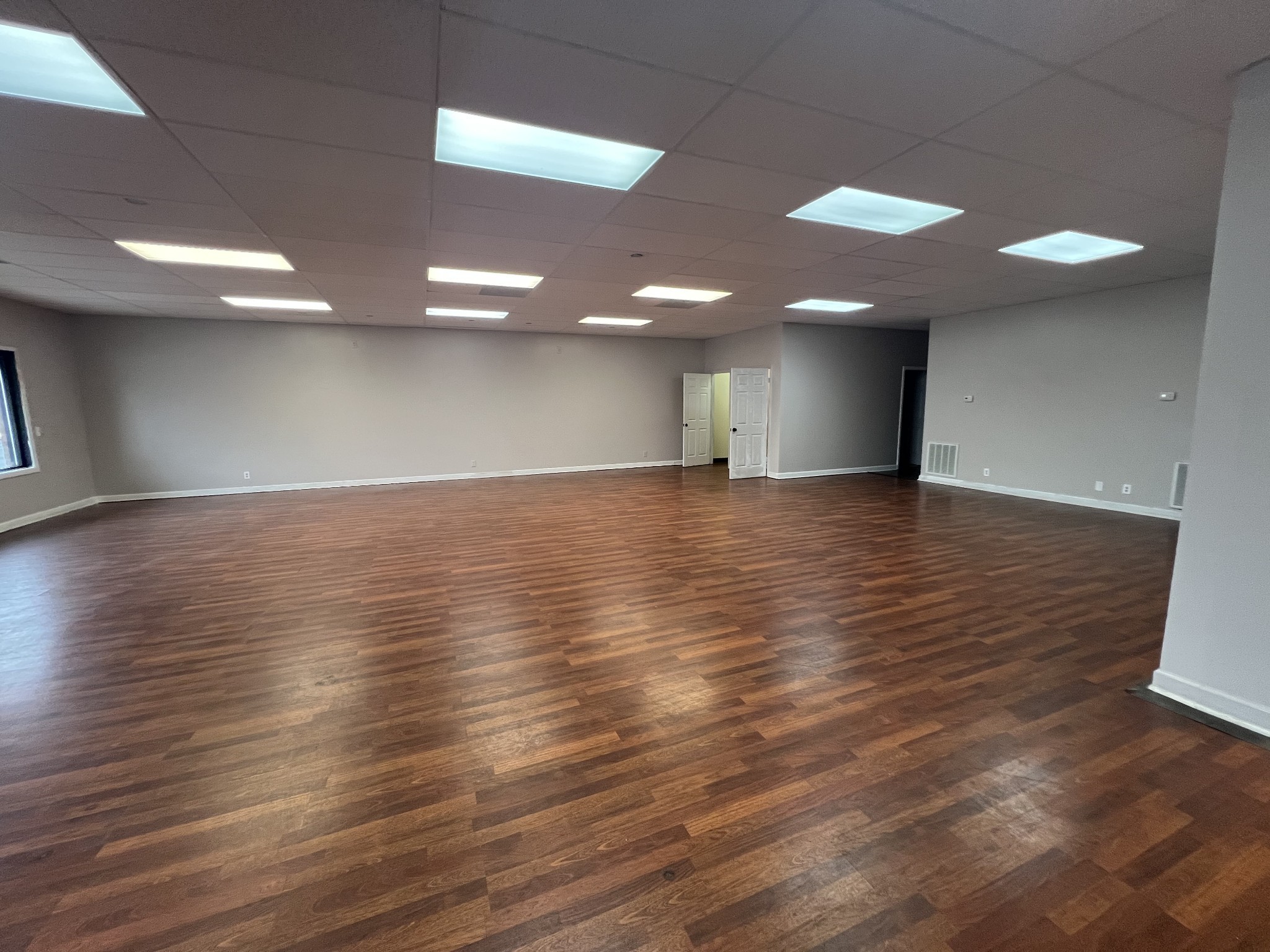 149 Kender Rhea Court Clarksville, TN 37043 - Photo 8 of 26 an empty room with wooden floor and entrance