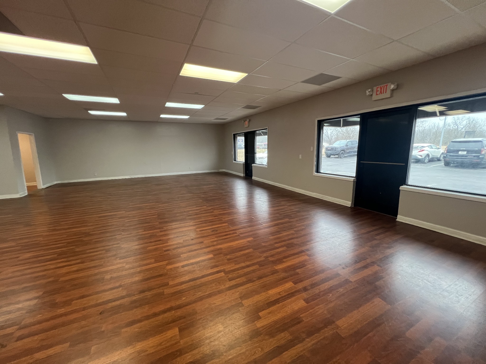 149 Kender Rhea Court Clarksville, TN 37043 - Photo 9 of 26 an empty room with wooden floor and windows