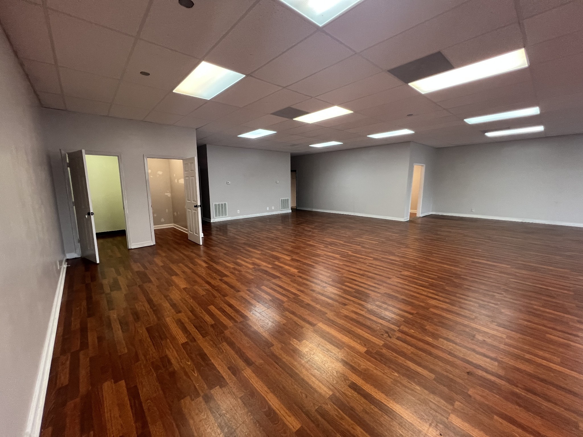 149 Kender Rhea Court Clarksville, TN 37043 - Photo 10 of 26 an empty room with wooden floor and windows
