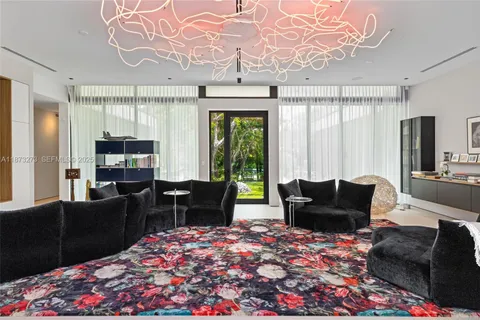 a room with furniture and a large window