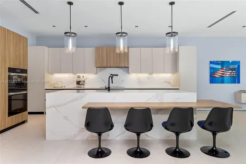 a bathroom with a double vanity sink bathtub and mirror