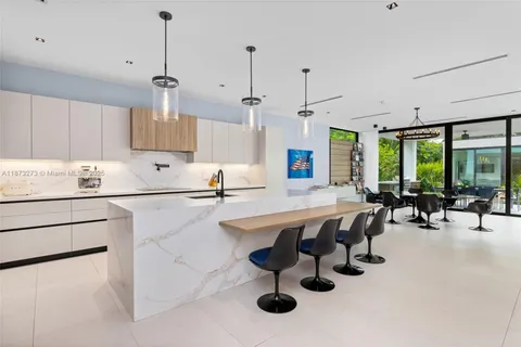 a view of walk in closet with clothes