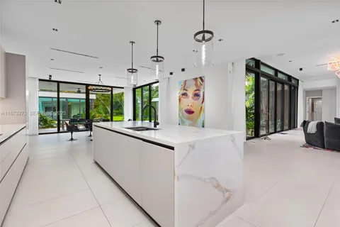 an aerial view of a house with outdoor space and lake view