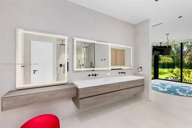 a view of a house with swimming pool and sitting area