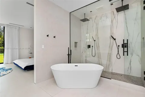 a room with furniture and a large window