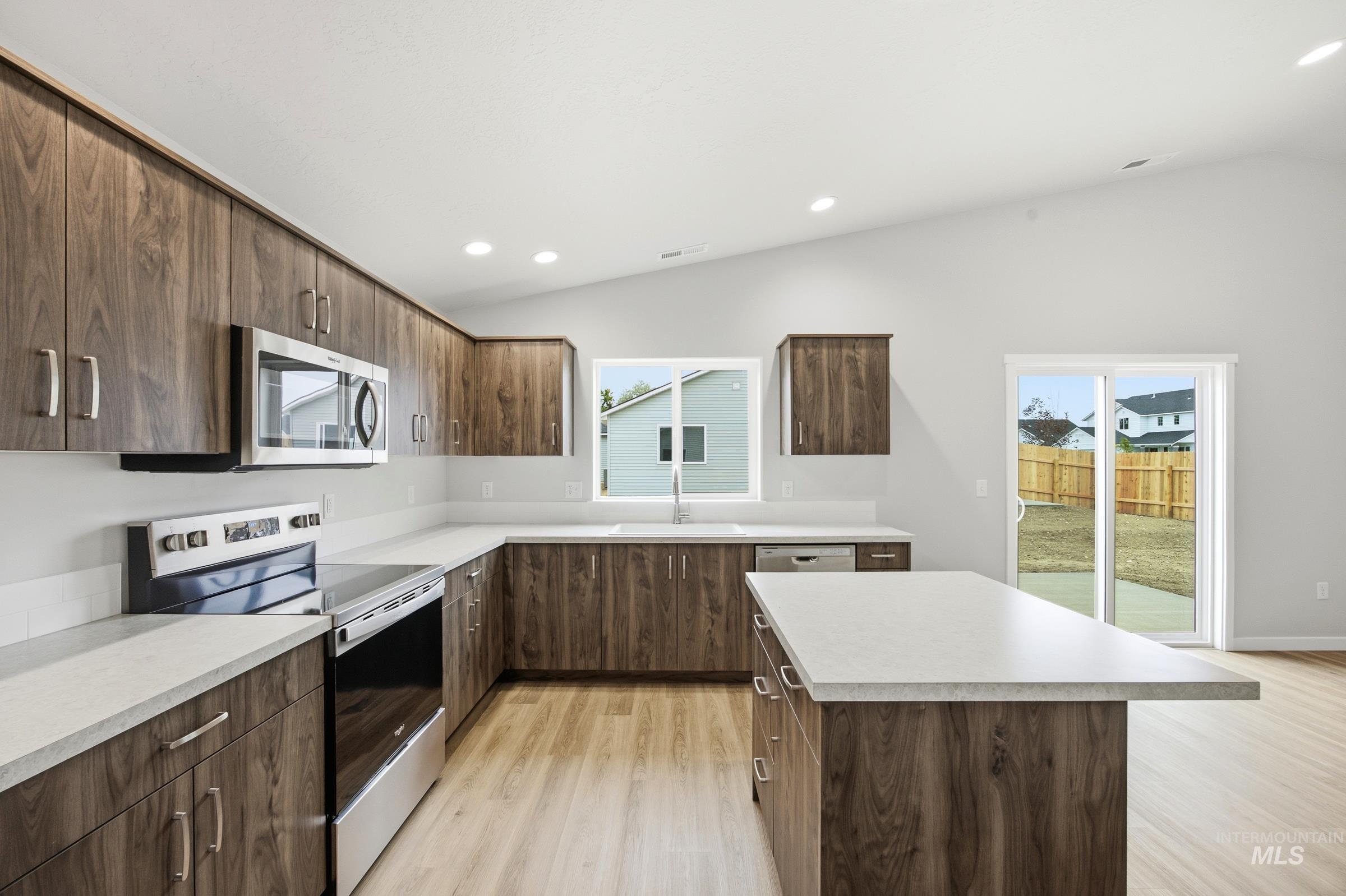 436 Merlin Court Middleton, ID 83644 - Photo 21 of 21 Dual vanity with wood-finish cabinetry and light-toned countertops