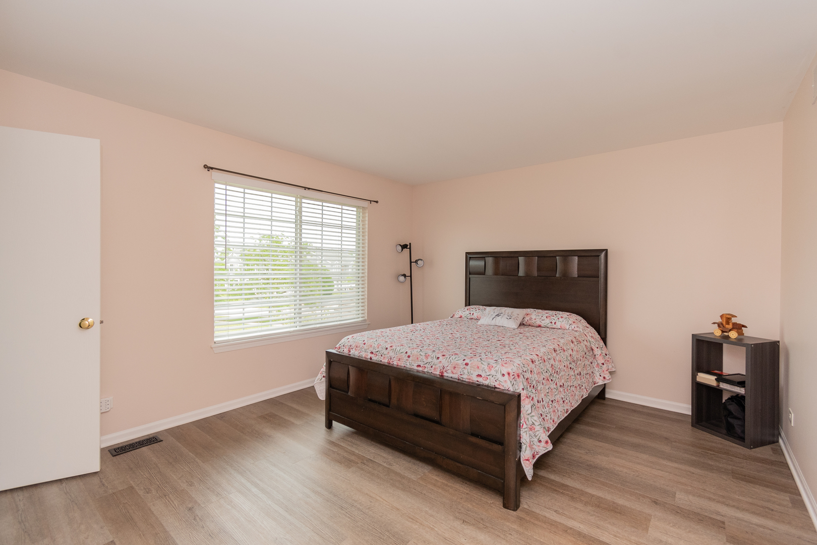 39672 Warren Lane Beach Park, IL 60083 - Photo 8 of 15 a bedroom with a bed and wooden floor