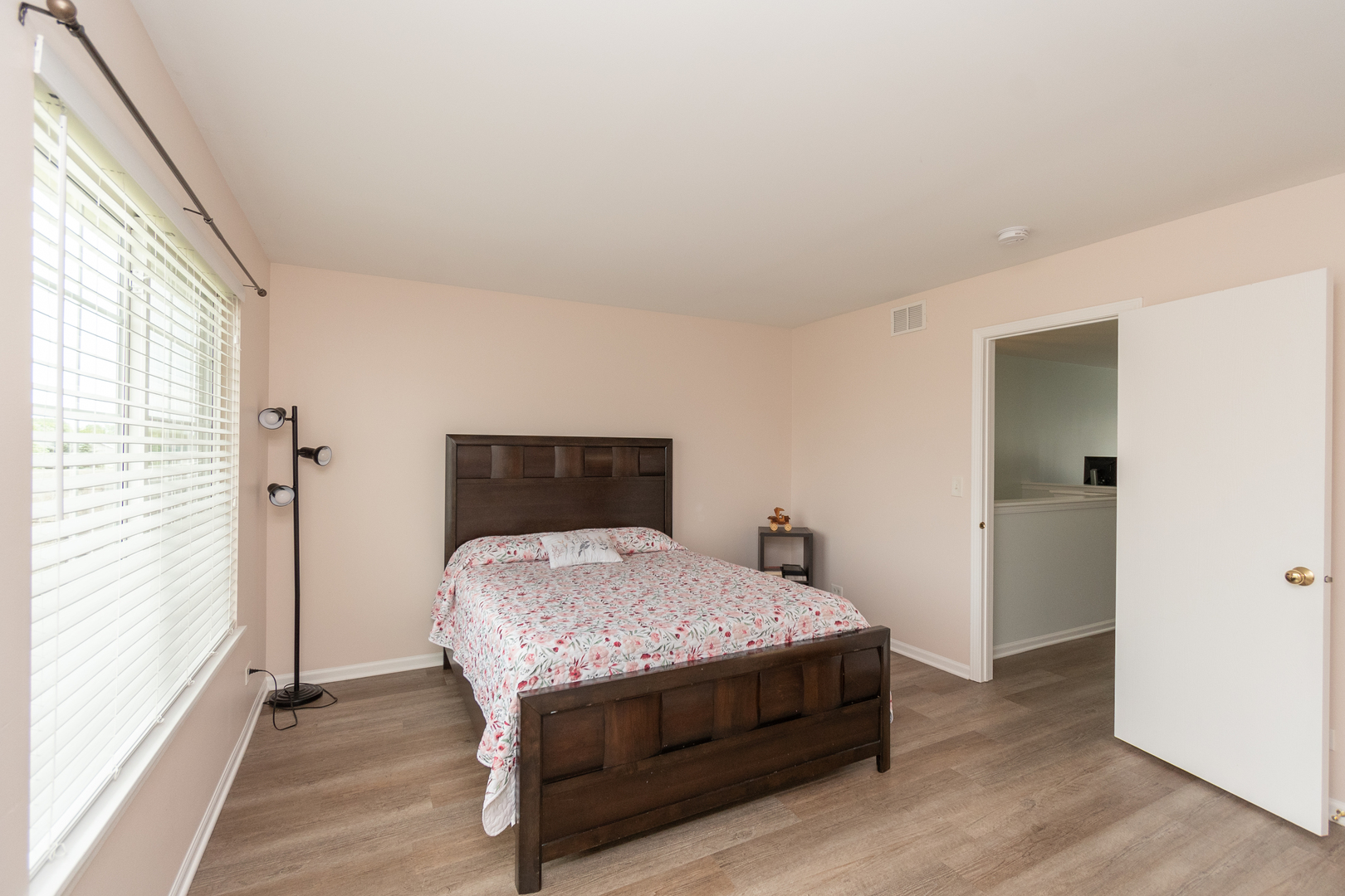 39672 Warren Lane Beach Park, IL 60083 - Photo 9 of 15 a bedroom with a bed and wooden floor