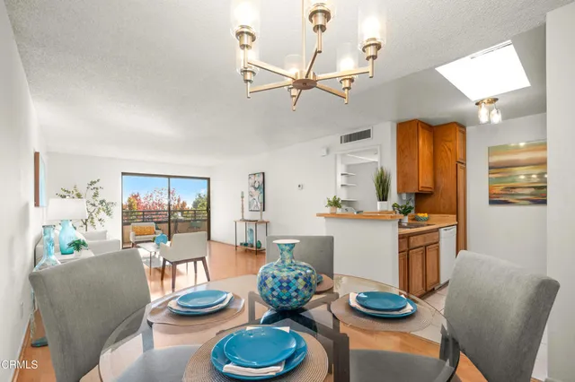 a kitchen with a table and chairs in it