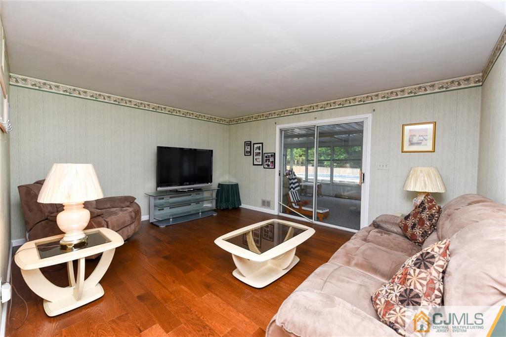 178 Princeton Road Old Bridge, NJ 08859 - Photo 3 of 16 a living room with furniture and a flat screen tv